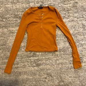 Forever 21 button up long sleeve shirt. Orange and slightly cropped.
